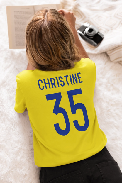 back-view-tee-mockup-of-a-woman-lying-face-down-while-reading-a-book-m37294