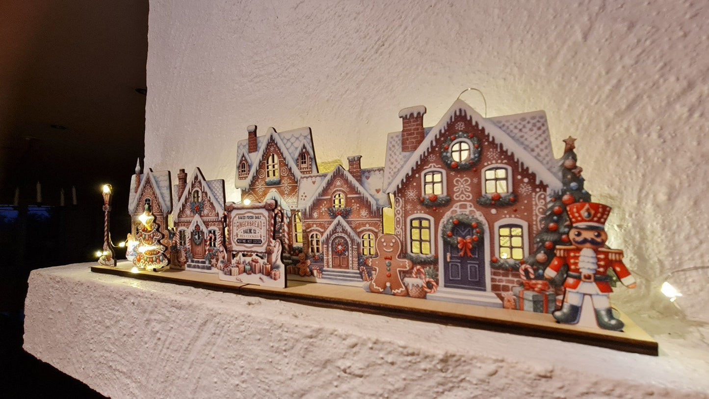 pepparkaksbyscen Placera LED-lampor för upplysta fönster pepparkaka