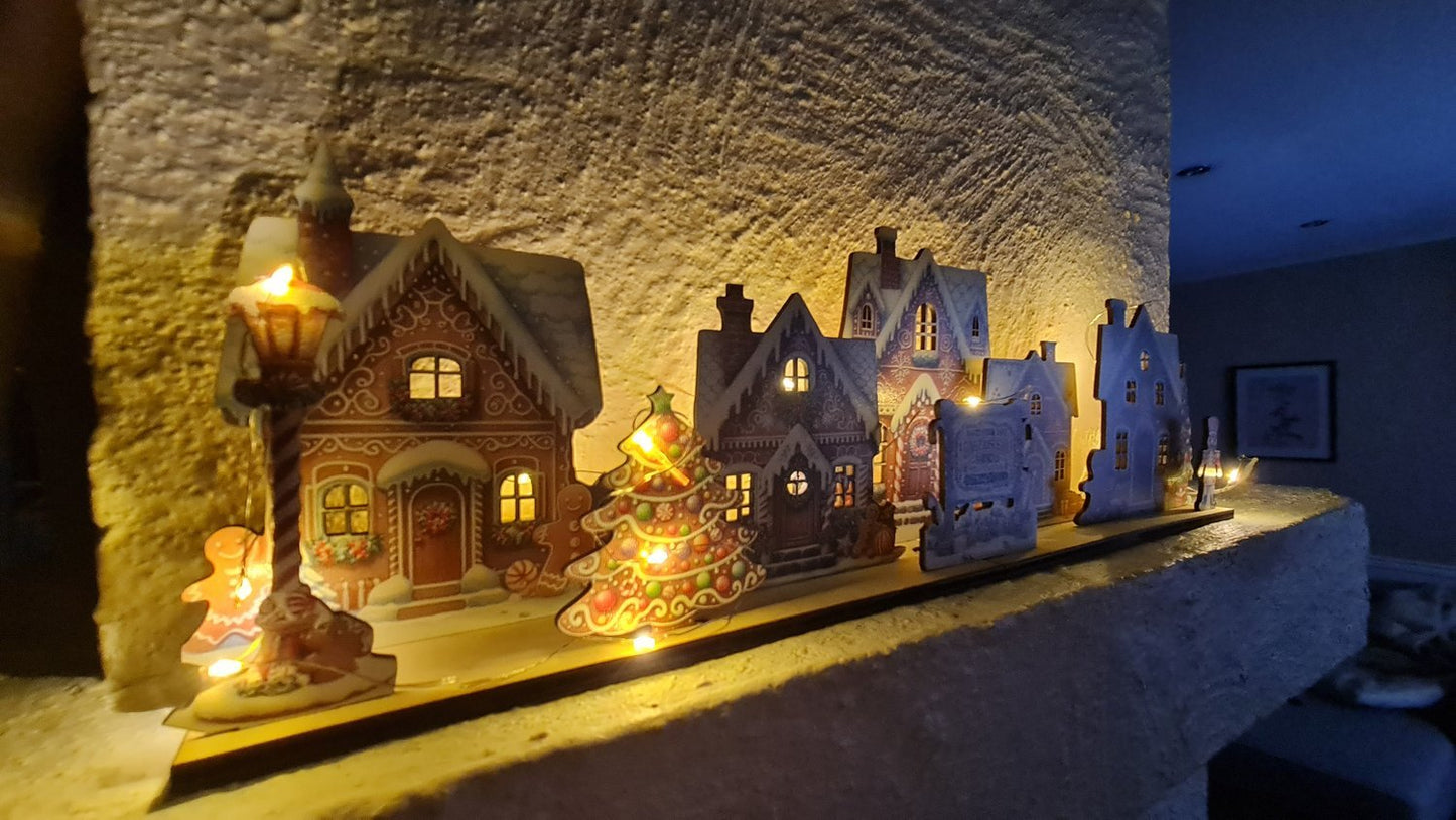 pepparkaksbyscen Placera LED-lampor för upplysta fönster pepparkaka