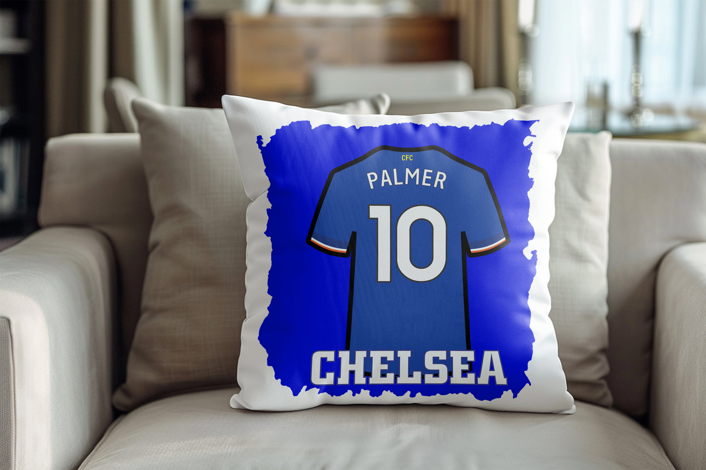 Pillow with Chelsea football jersey design featuring the number 10 and name 'Palmer' on a sofa.